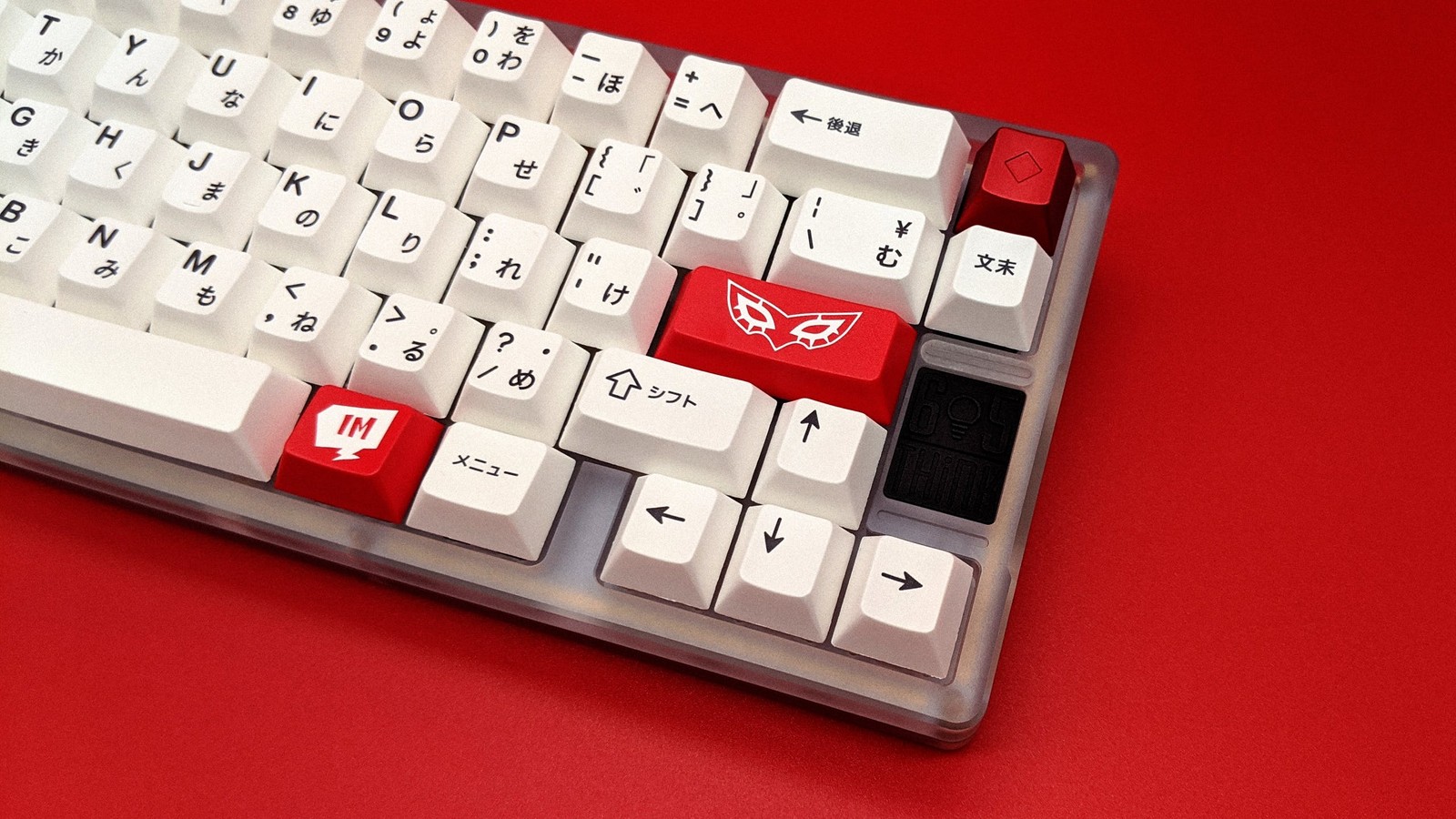 Think 6.5 keyboard with kuro/shiro keycaps and GMK Metaverse red accents on red background