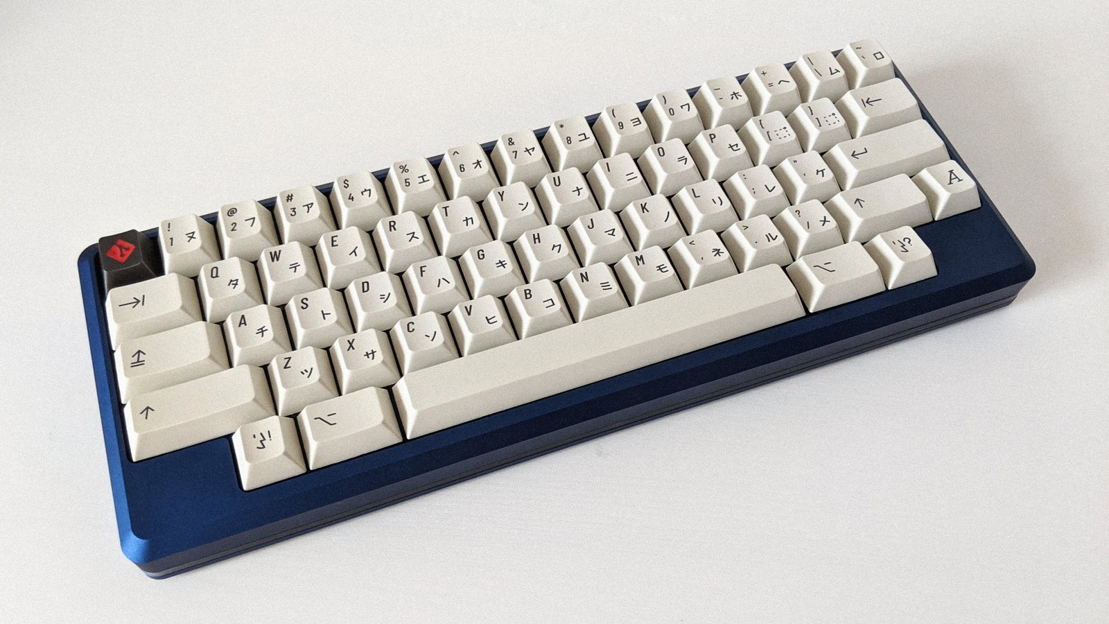 Extended 2048 with RAMA Git keycap on blue Tokyo60  on white background