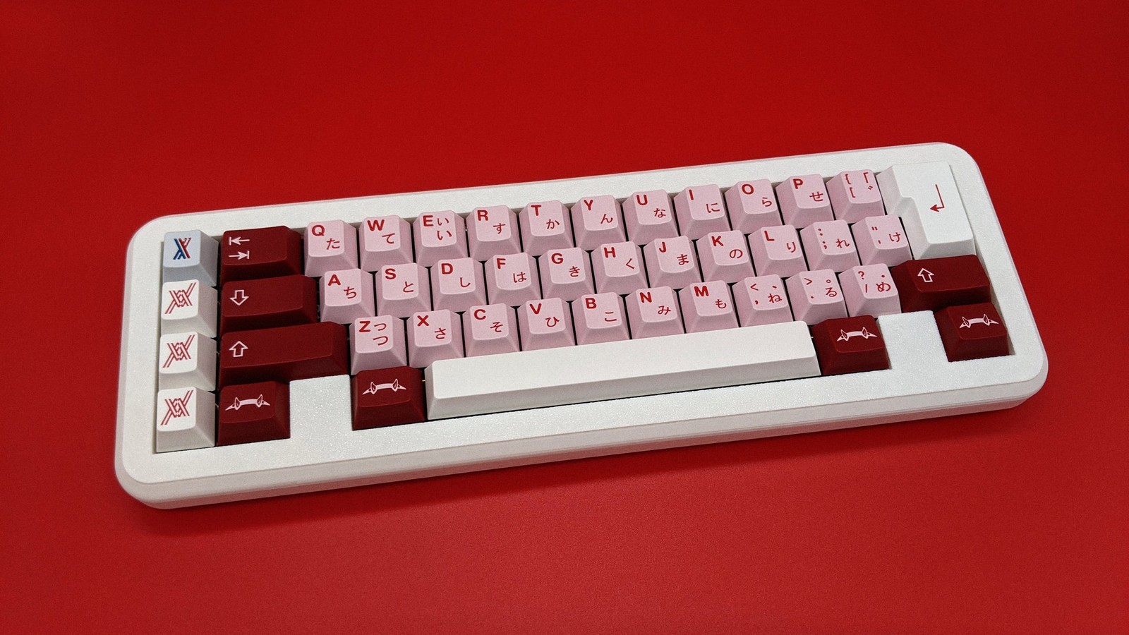 Full shot of GMK Darling on Liminal on a red background