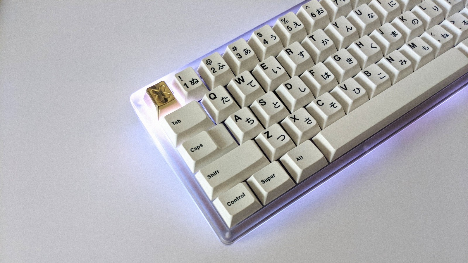 GMK MetaMinimal and RAMA brass keycap on Think 6.5 with white underglow LEDs turned on